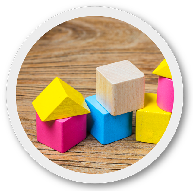 Colorful wooden blocks on a wooden surface cleaned with Chimiver Cleaning product Soft Balm